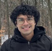 Portrait shot of grad student in snowy background.